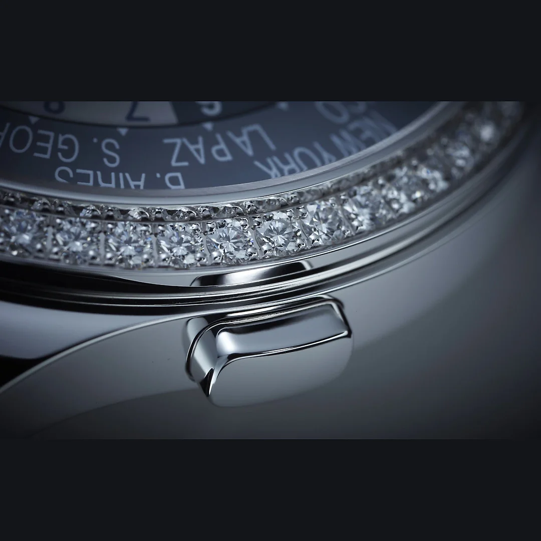 Patek Philippe Women’s Complication World-Time, 18k White Gold set with 89 diamonds (~1.03 ct.), 36mm, Ref# 7130G-016